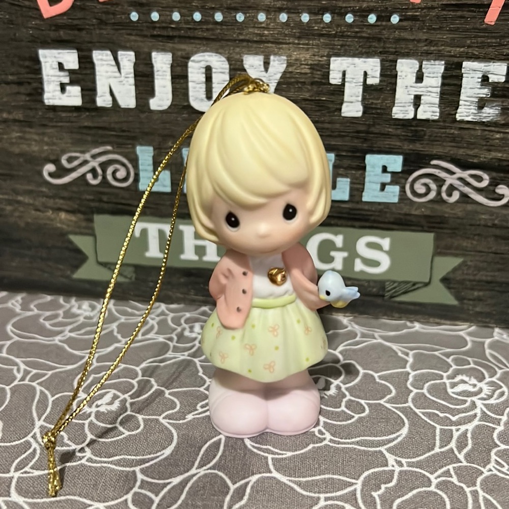 Precious Moments figurine. Girl with gold heart.